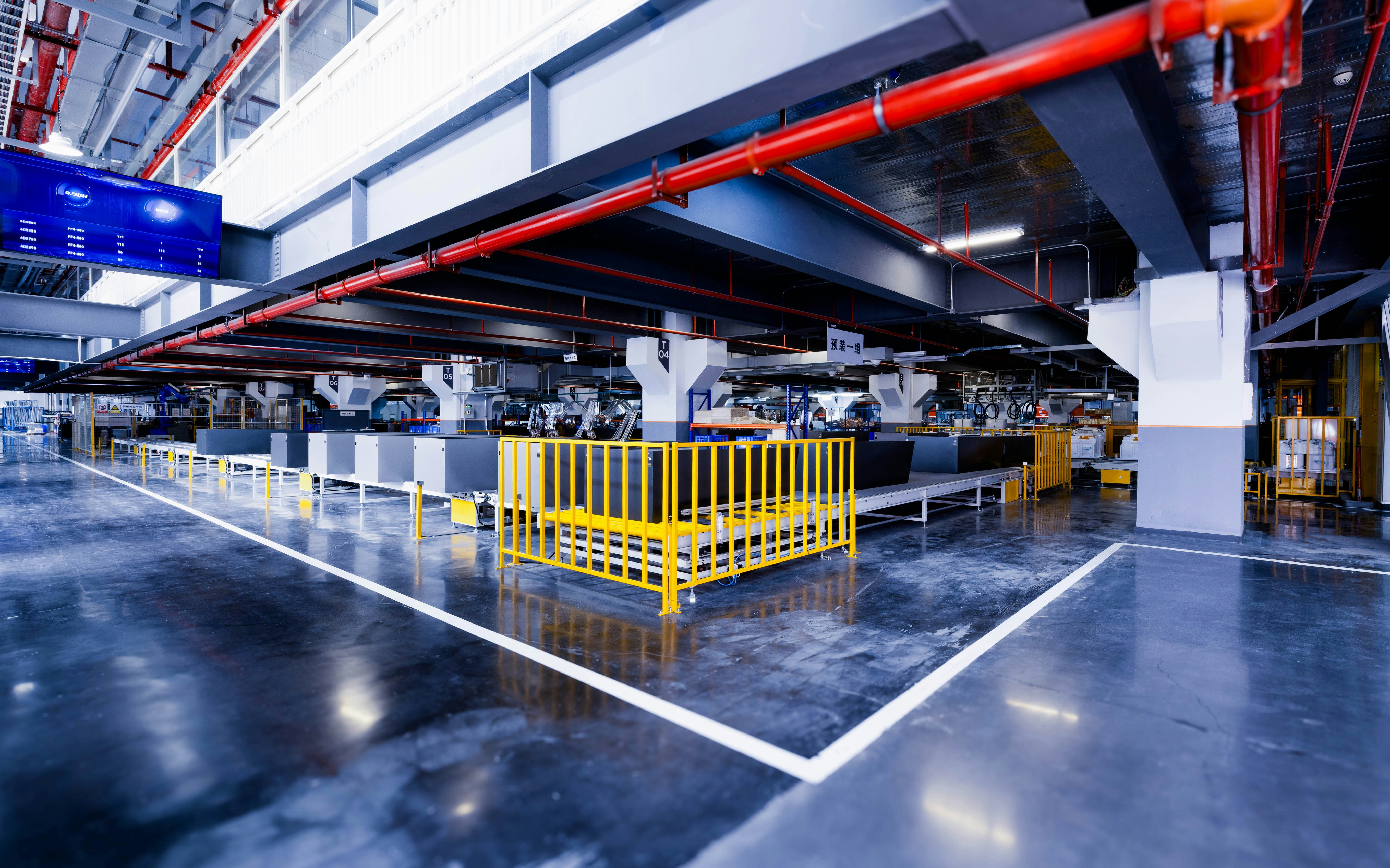 Modern industrial plant floor with conveyor systems